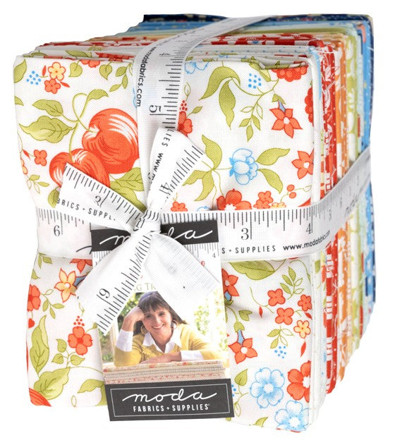 Collection of floral fabric bundles with a measuring tape and Moda label. Sold by Sewing Bee Studio.