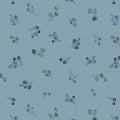 Fabric pattern of small leaves and branches on a blue background. (Sewing Bee Studio)