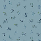 Fabric pattern of small leaves and branches on a blue background. (Sewing Bee Studio)