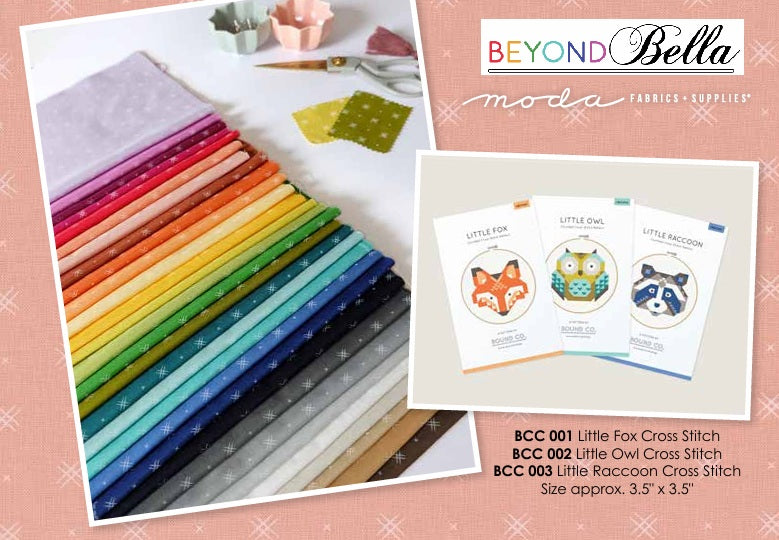 Colorful fabric strips and fabric labels with 'Beyondbella' branding on a pink background. Charm pack bundle sold by Sewing Bee Studio.