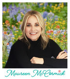 Fabric designer, Maureen McCormick in black sweater posing in a field of colorful flowers, promoting fabric collection, "Flower Power," bundle sold by Sewing Bee Studio.