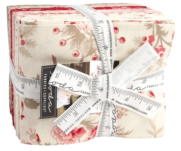 Bundle of floral fabric collection with Moda branding cloth ruler for scale. Fat quarter bundle sold by Sewing Bee Studio.