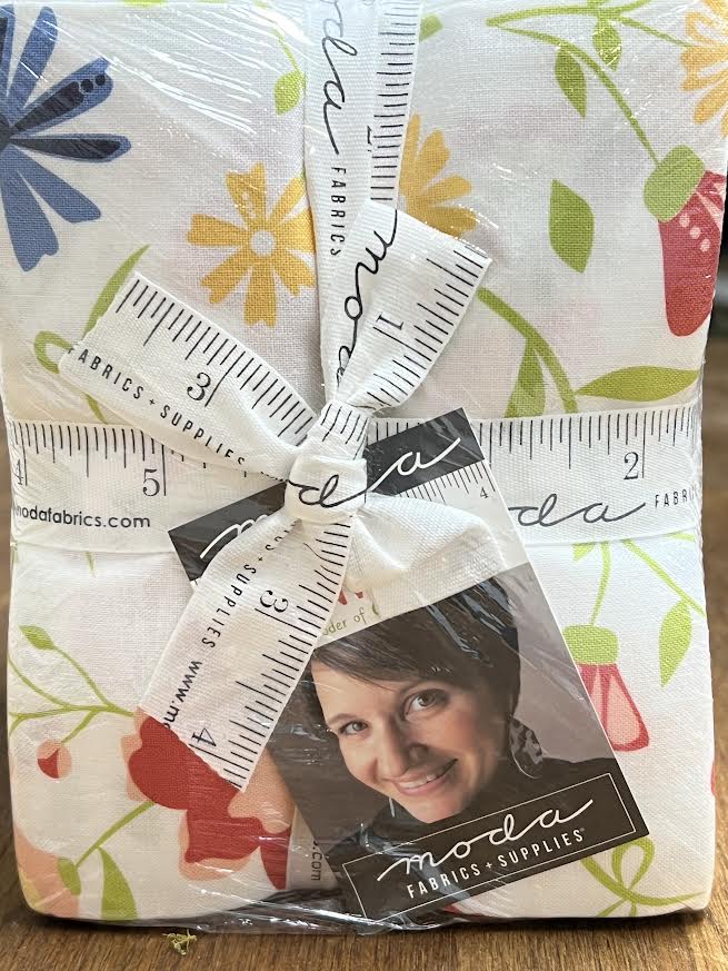 Packaged fabric with floral pattern and Moda label. Fat quarter bundle is sold by Sewing Bee Studio.
