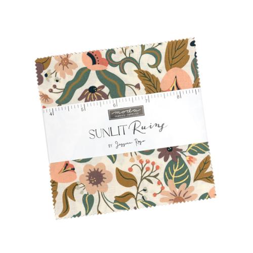 Fabric bundle with floral pattern and ruler on a white background