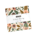 Fabric bundle with floral pattern and ruler on a white background