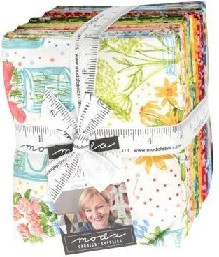 Pack of colorful fabric fat quarters bundled with a ruler and Moda label. Sewing Bee Studio.